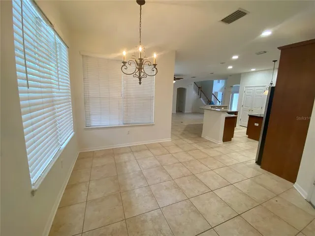 a view of a room with a chandelier