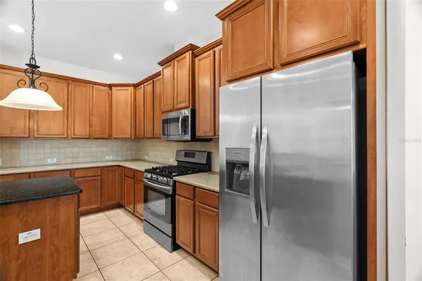 a kitchen with a counter space a sink and appliances