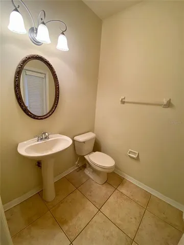 a bathroom with a toilet and a sink