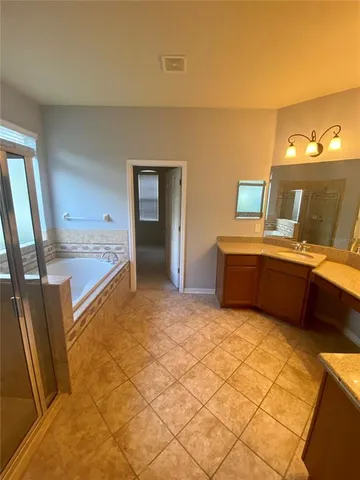 a bathroom with a sink and mirror