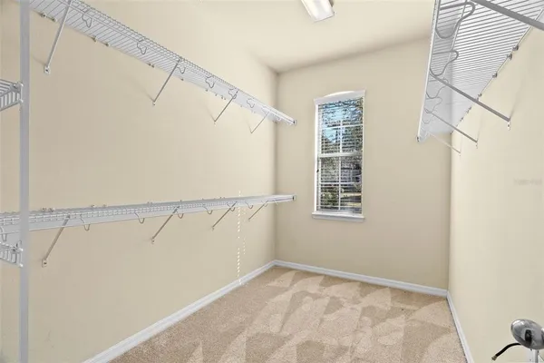 a bathroom with a toilet a sink and a mirror