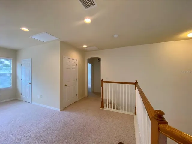 a view of hallway with stairs
