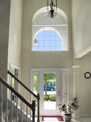 a view of hall way with furniture