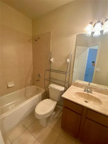 a bathroom with a sink a toilet and bathtub