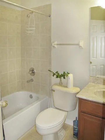 a bathroom with a toilet a sink and bathtub