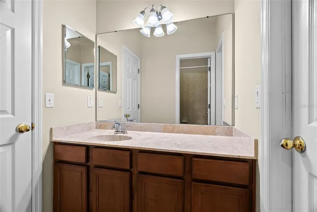 a white bath tub sitting next to a white toilet and sink