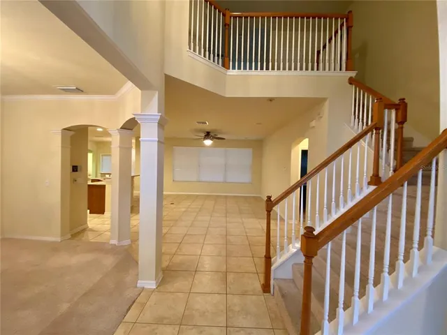 a view of an entryway door with staircase