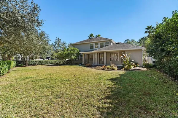 a view of outdoor space with garden and trees