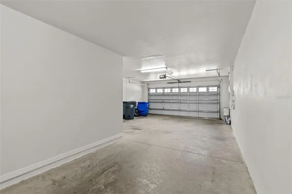 an aerial view of a house with a yard and garden