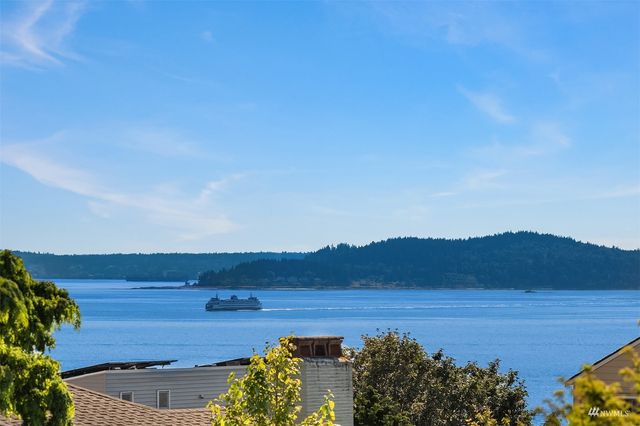 a view of an ocean and mountain
