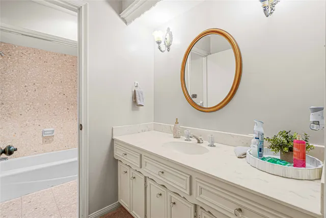 a bathroom with a sink and a mirror