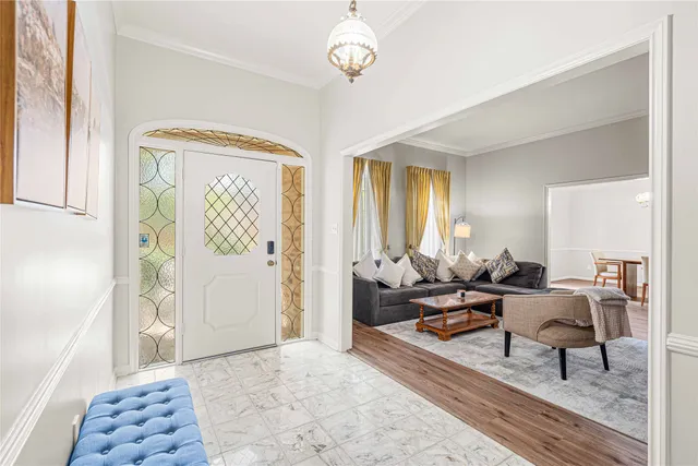 a living room with furniture a rug and a window