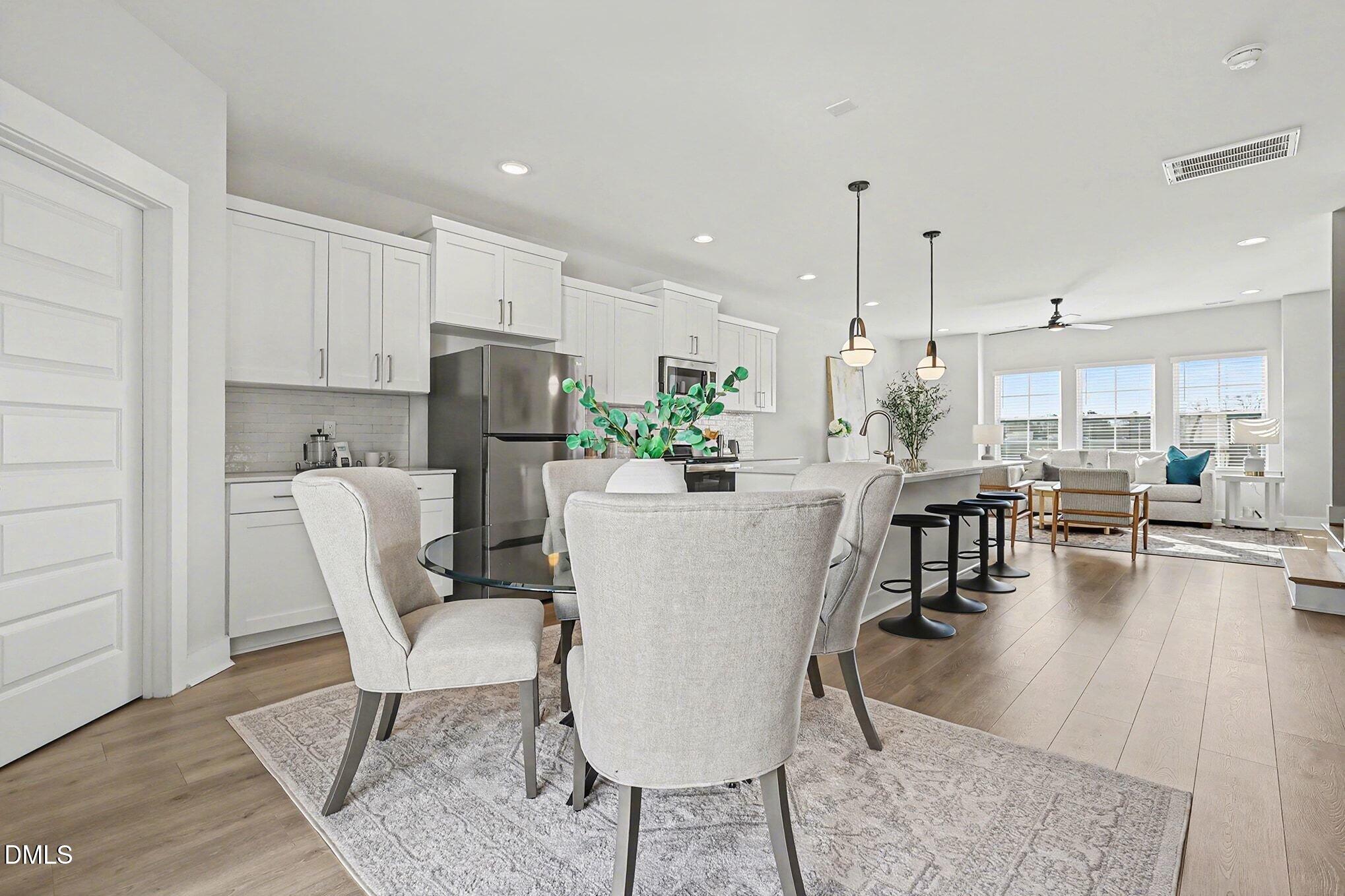 8512 Silsbee Drive Raleigh, NC 27613 - Photo 12 of 42 a view of kitchen and dining area with furniture