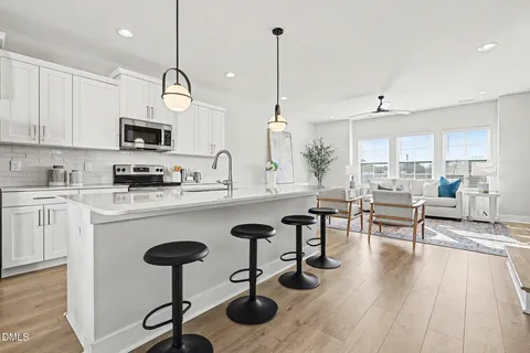 a view of kitchen and dining area with furniture
