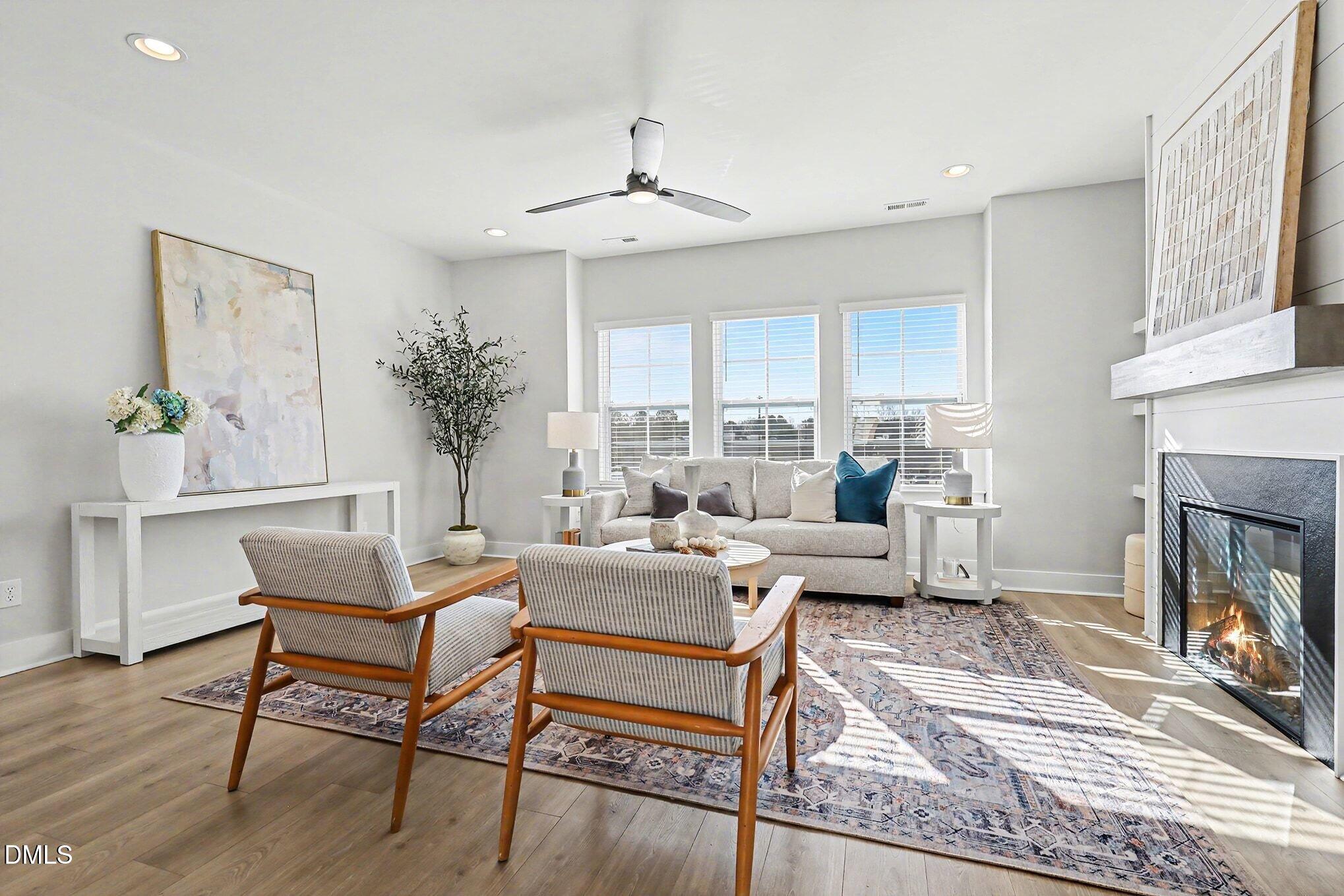 8512 Silsbee Drive Raleigh, NC 27613 - Photo 18 of 42 a living room with furniture and a fireplace