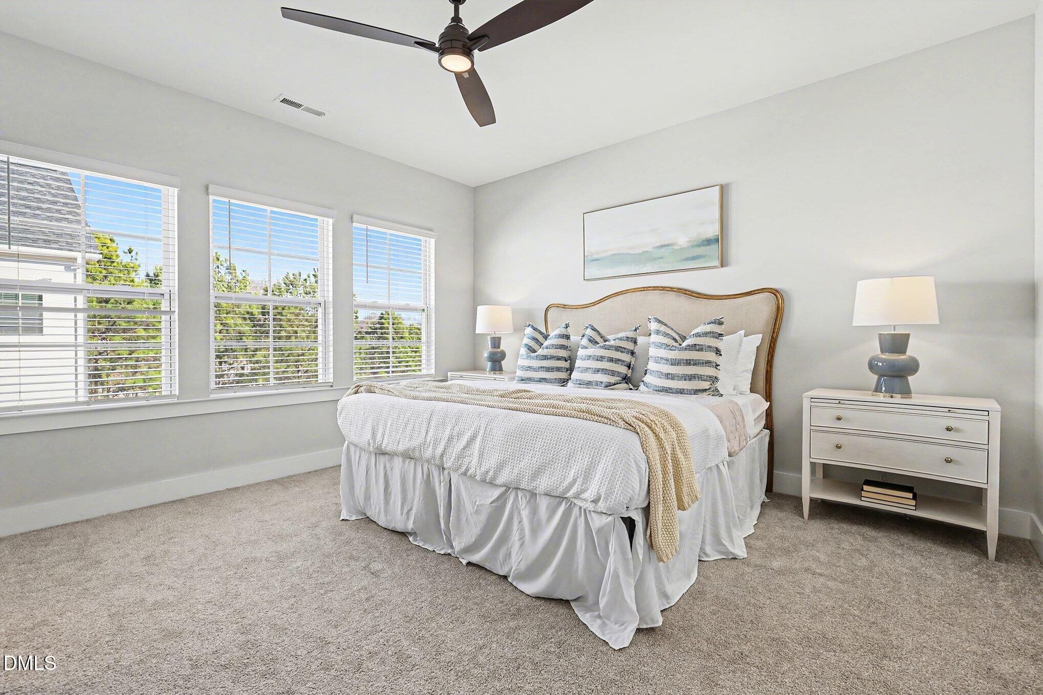8512 Silsbee Drive Raleigh, NC 27613 - Photo 25 of 42 a bedroom with a bed and a window