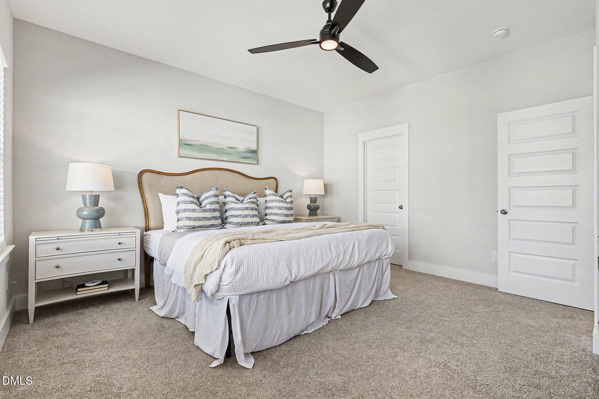 8512 Silsbee Drive Raleigh, NC 27613 - Photo 26 of 42 a bedroom with a bed and a cabinets