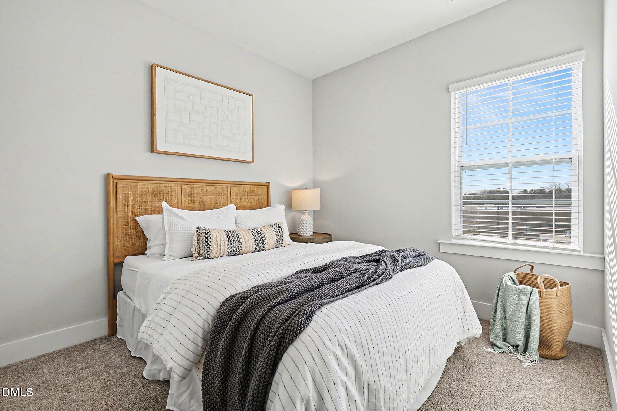 8512 Silsbee Drive Raleigh, NC 27613 - Photo 28 of 42 a bedroom with bed and a window