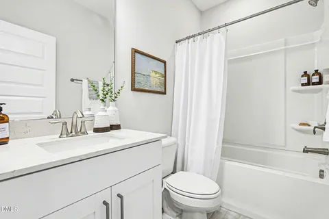 a bedroom with bed and a window