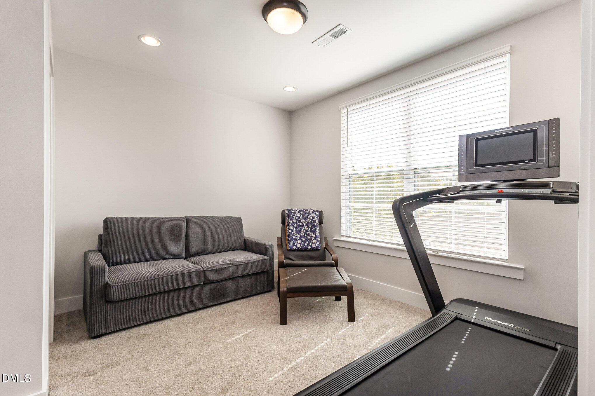 8512 Silsbee Drive Raleigh, NC 27613 - Photo 3 of 42 a living room with furniture and a flat screen tv