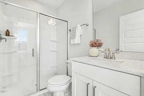 a spacious bedroom with a bed and a window