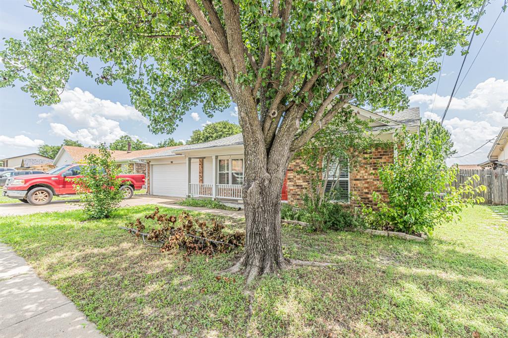 6504 Johnnie Street Watauga, TX 76148 - Photo 2 of 23 Mature shade tree with a manicured front lawn
