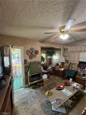 a living room with furniture gym equipment and a window