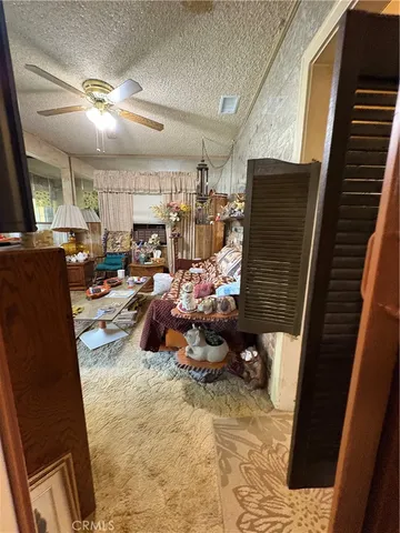 a living room with lots of furniture and a fireplace