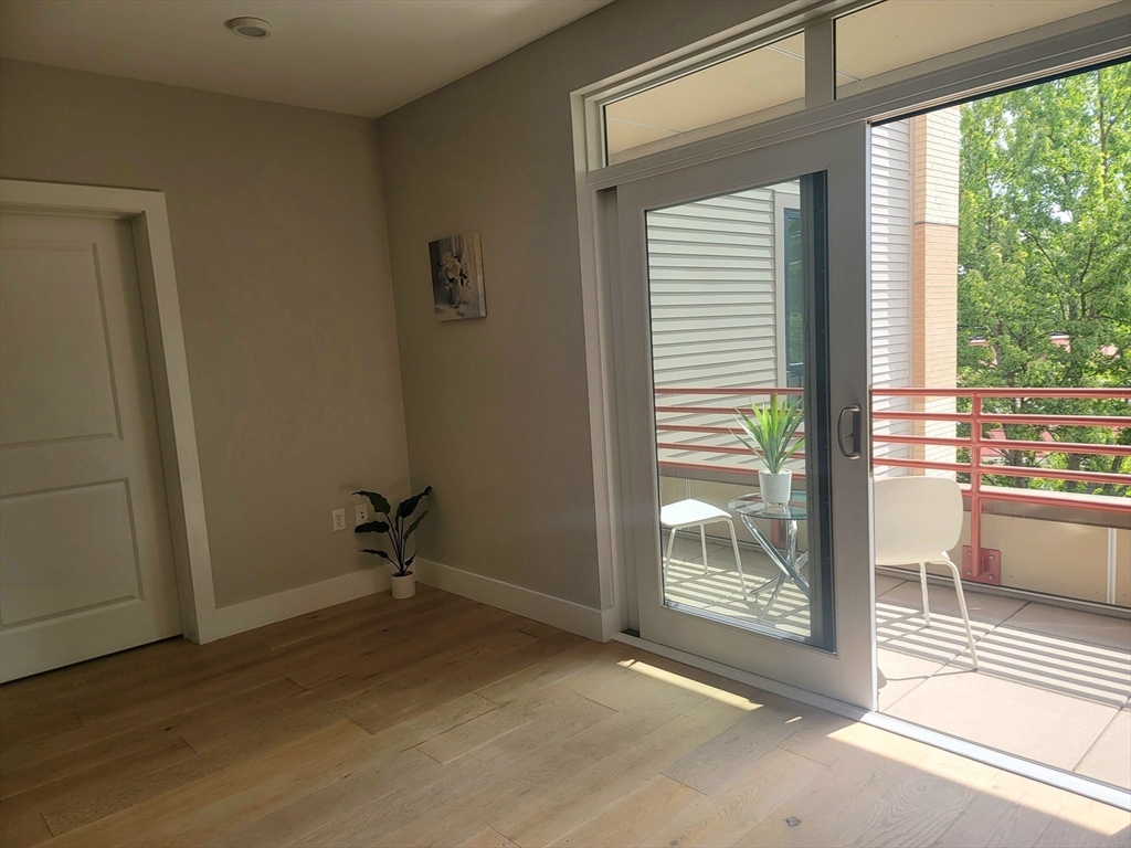 1650 Commonwealth Avenue, Unit 304A Boston, MA 02135 - Photo 12 of 26 a view of a room with a large window