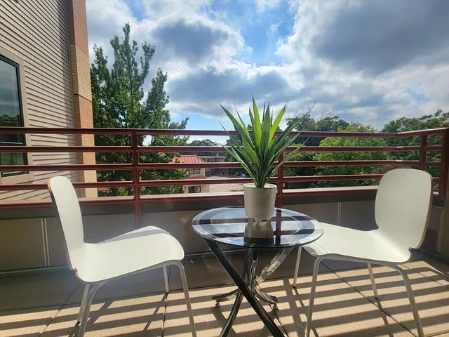 a view of a chairs and table in the patio