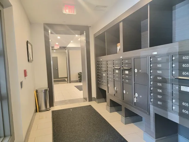 a bathroom with a tub shower vanity and a sink