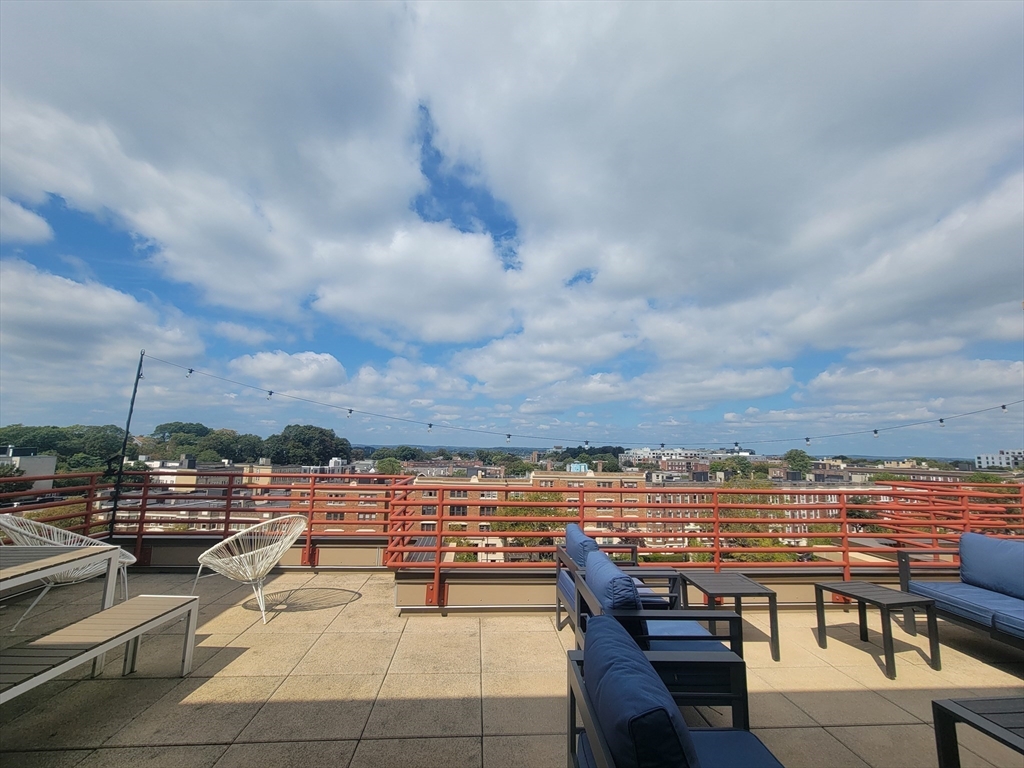 1650 Commonwealth Avenue, Unit 304A Boston, MA 02135 - Photo 23 of 26 a view of a terrace with lawn chairs