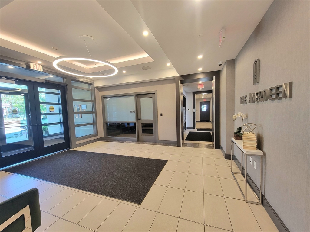 1650 Commonwealth Avenue, Unit 304A Boston, MA 02135 - Photo 3 of 26 a view of an entryway with a livingroom