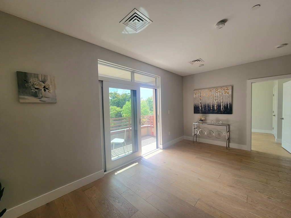 1650 Commonwealth Avenue, Unit 304A Boston, MA 02135 - Photo 10 of 26 a view of an empty room with a window