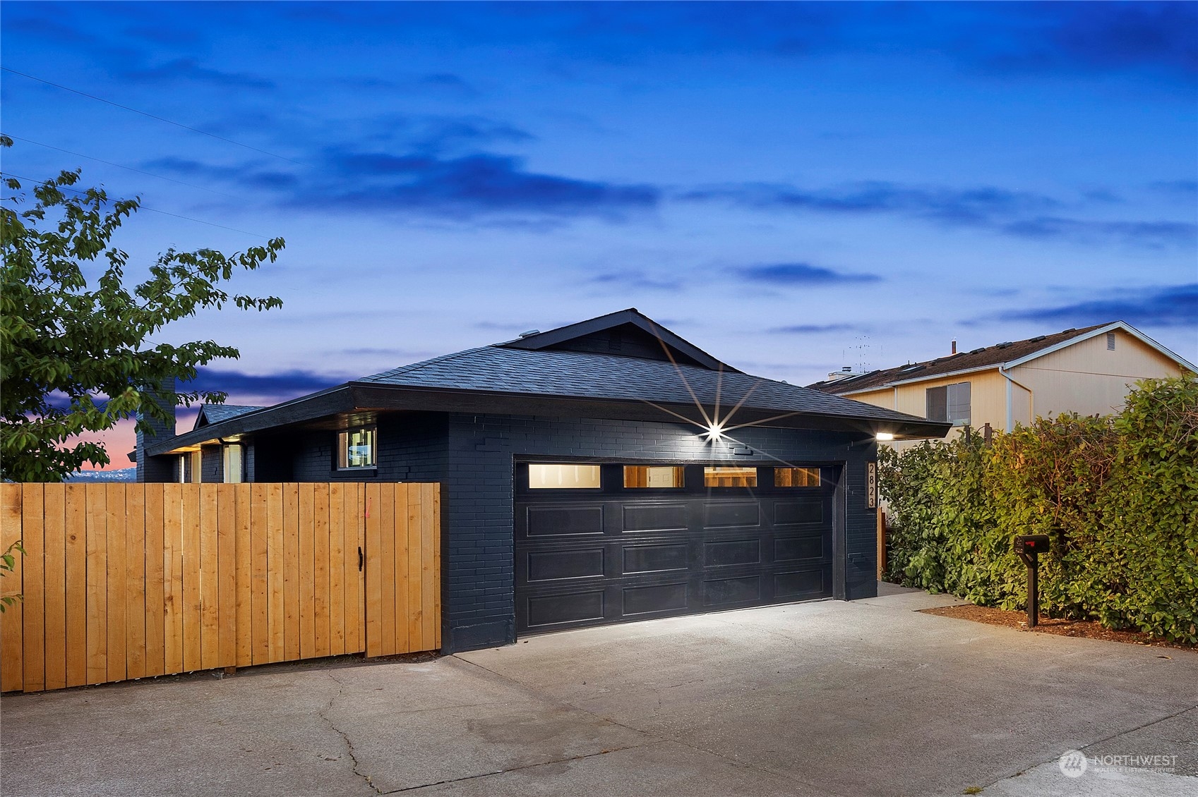 a front view of a house with a garage