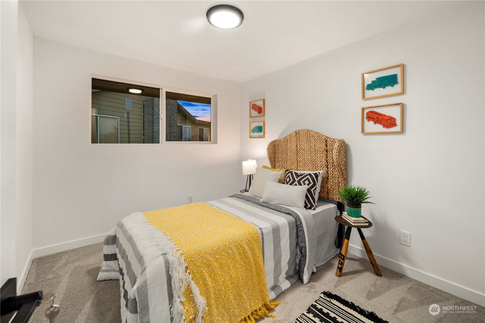 2823 South Bateman Street Seattle, WA 98108 - Photo 19 of 39 a bedroom with a bed and a painting on the wall