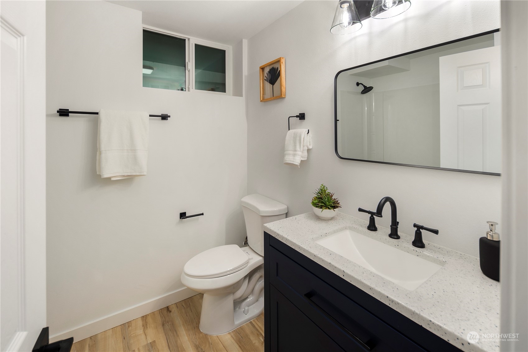2823 South Bateman Street Seattle, WA 98108 - Photo 26 of 39 a bathroom with a sink a toilet and shower