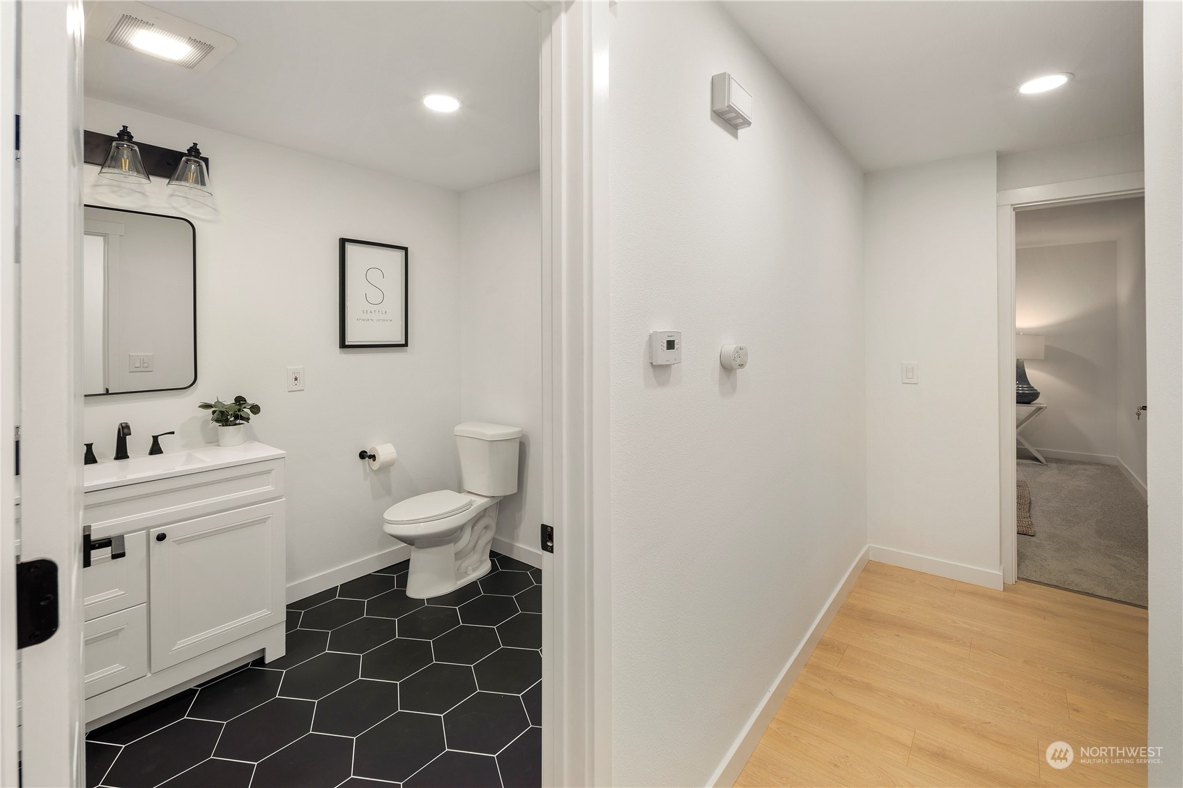2823 South Bateman Street Seattle, WA 98108 - Photo 28 of 39 a bathroom with a sink and a mirror