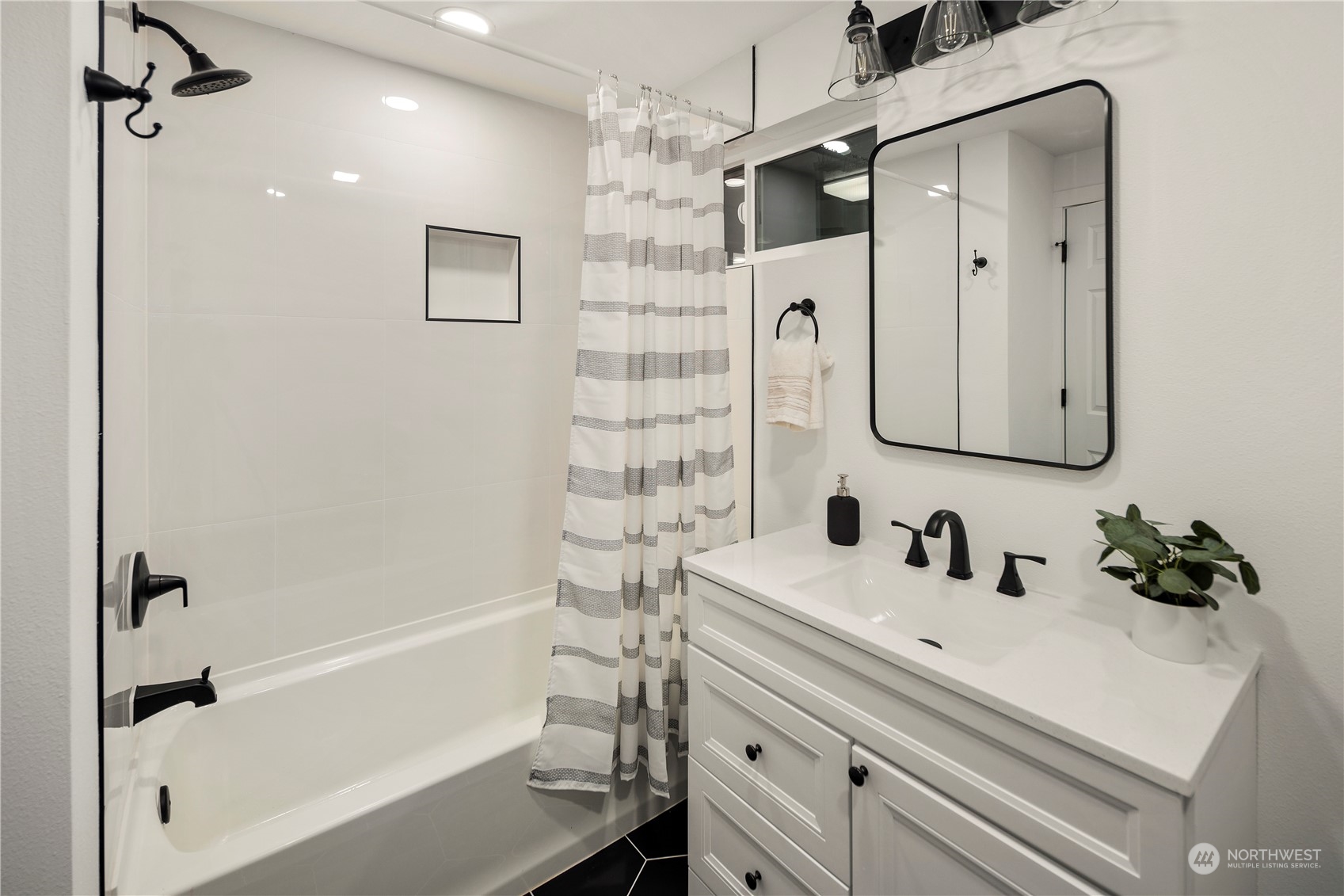 2823 South Bateman Street Seattle, WA 98108 - Photo 29 of 39 a bathroom with a sink tub vanity and shower