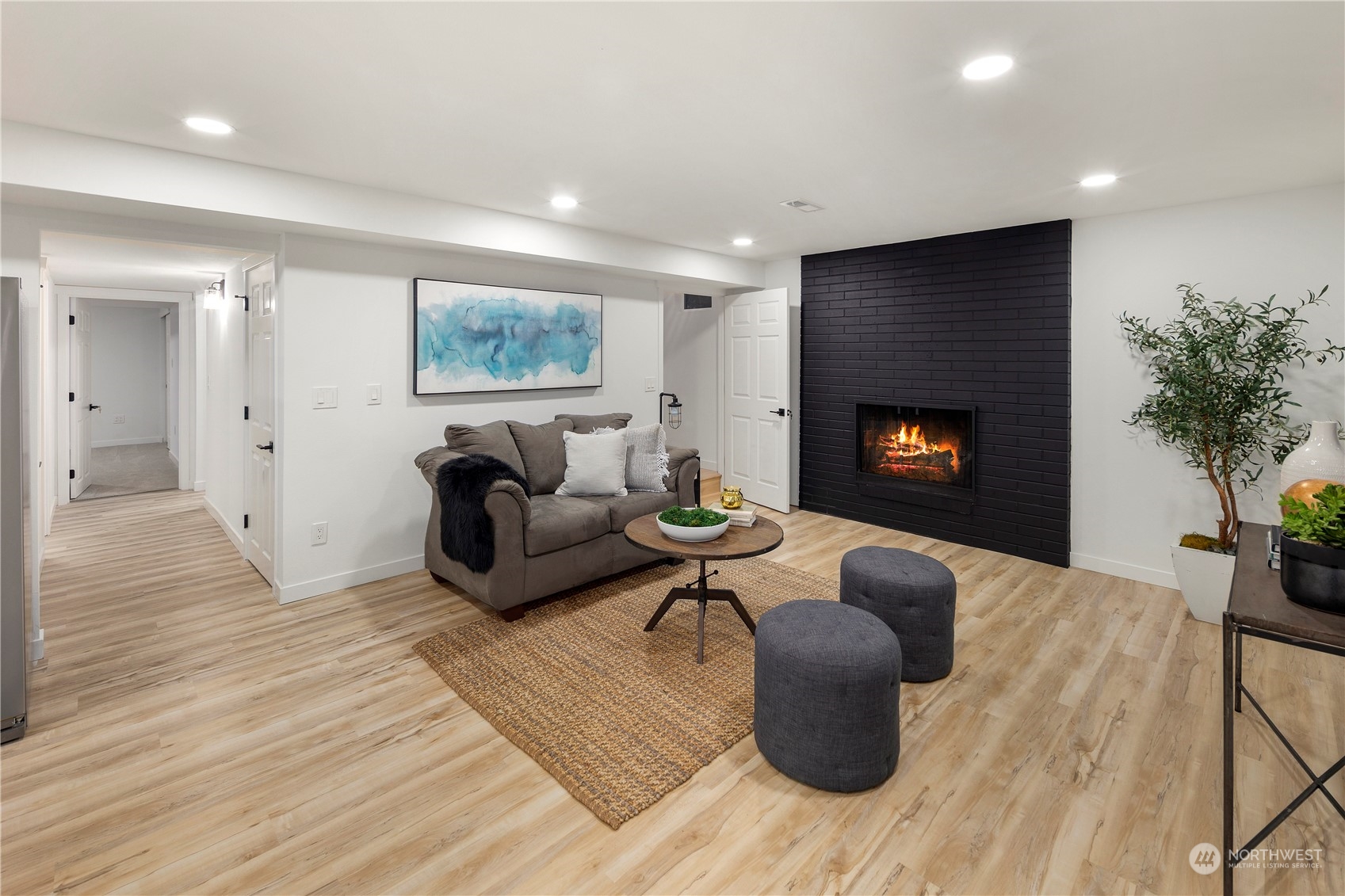 2823 South Bateman Street Seattle, WA 98108 - Photo 32 of 39 a living room with furniture and a fireplace