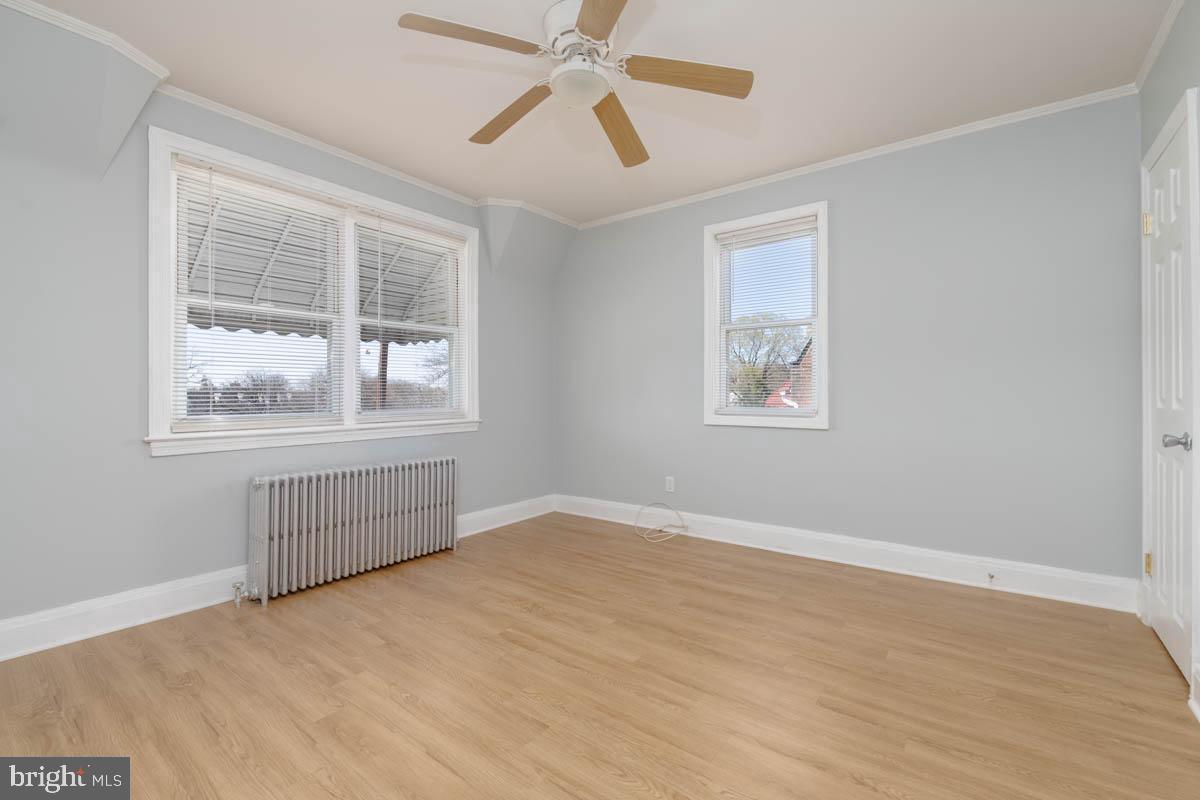 2475 Fairway Baltimore, MD 21222 - Photo 10 of 25 a view of an empty room with a window and wooden floor