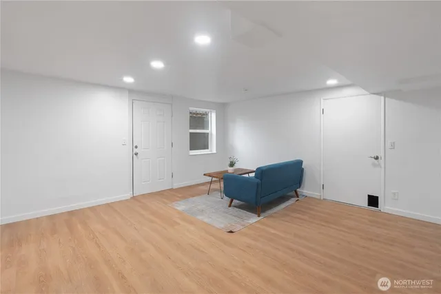 a room with a bed and window