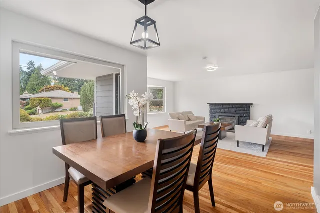 a view of a dining room with furniture window and outside view