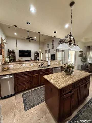 a kitchen with a stove and a sink
