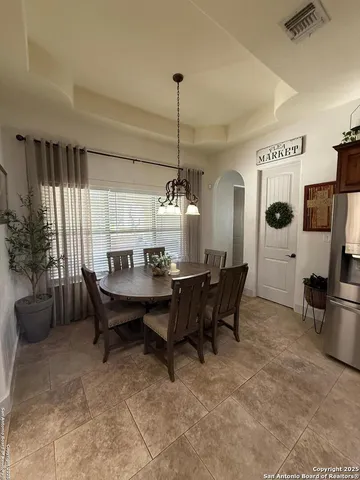 a view of a dining room with furniture