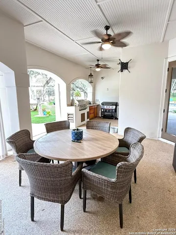 a view of a couches in patio and a yard