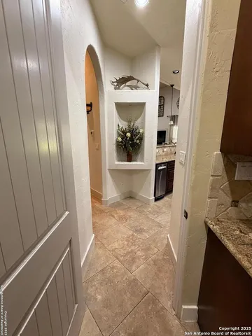 a view of a kitchen from the hallway