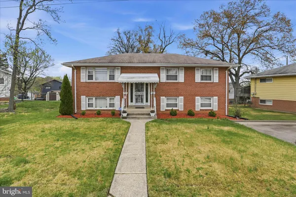 a front view of a house with yard porch and furniture