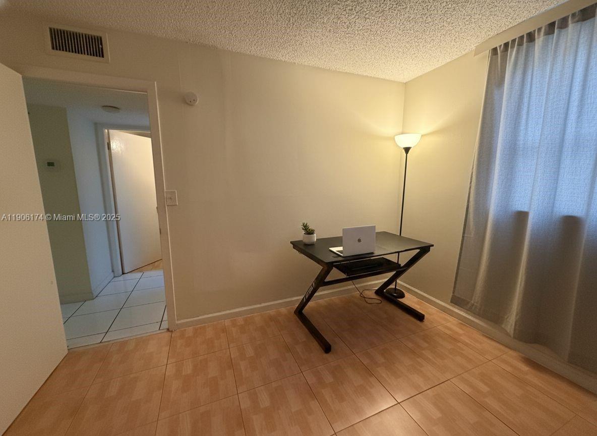 1820 Southwest 81st Avenue, Unit 3107 North Lauderdale, FL 33068 - Photo 14 of 25 a view of a hallway with seating area