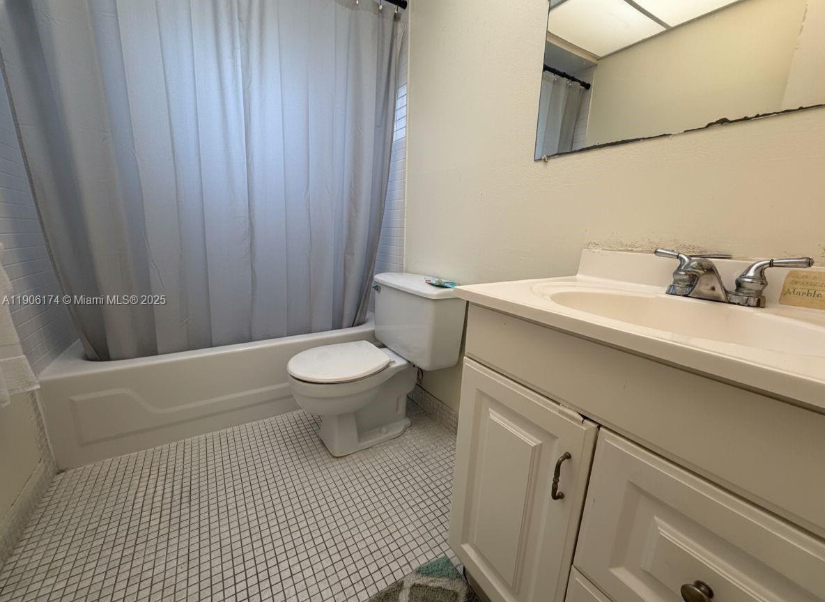 1820 Southwest 81st Avenue, Unit 3107 North Lauderdale, FL 33068 - Photo 15 of 25 a bathroom with a sink a toilet and shower
